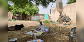 People are getting covid treatments under the tree on cots in UP village
