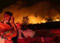 Greek’s second largest island gets engulfed by fire, residents urged to flee.