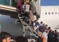 Hundreds jostle to board planes- desperate scenes at Kabul airport.