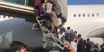 Hundreds jostle to board planes- desperate scenes at Kabul airport.