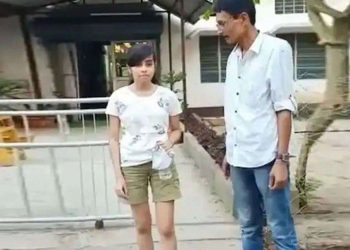 19-year-old in shorts made to take exam wrapped in curtain