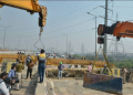 Police dismantle barricades from the Ghazipur farmers’ protest site following a Supreme Court decision